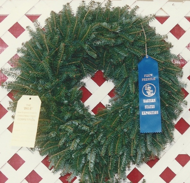 A plain balsam wreath with a First Premium ribbon from the Eastern States Exposition